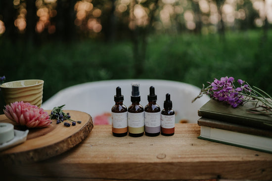 all natural skin care in glass bottles with forest bath outside in nature 